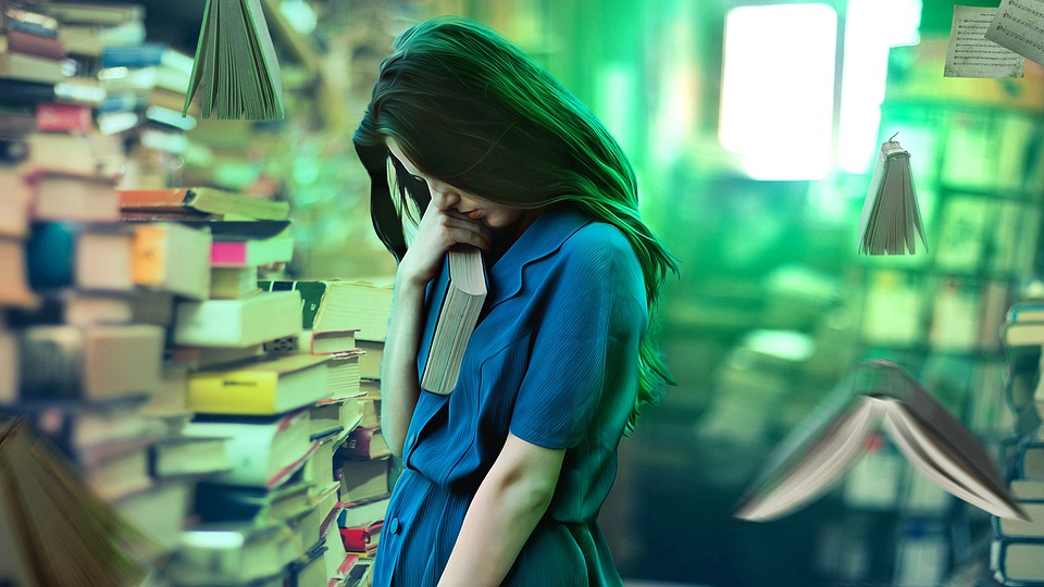 A girl in a room full of books, with some of the books flying around