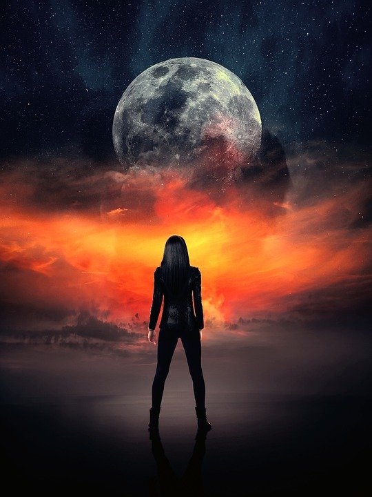 A silhouette of a woman facing some sort of cosmic explosion below a full moon